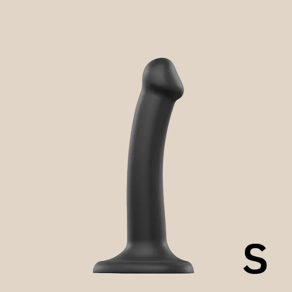 Small black silicone curved dildo with suction base on white background