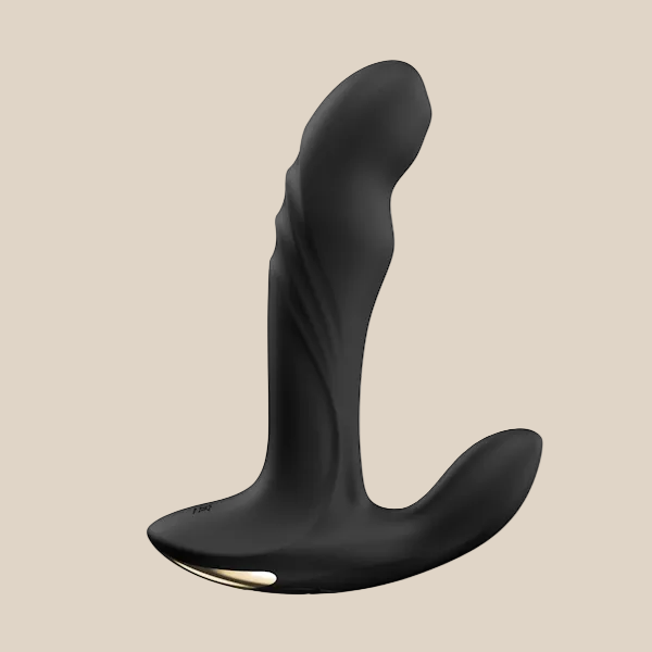 Black silicone prostate massager with ergonomic shape and gold accent on neutral background