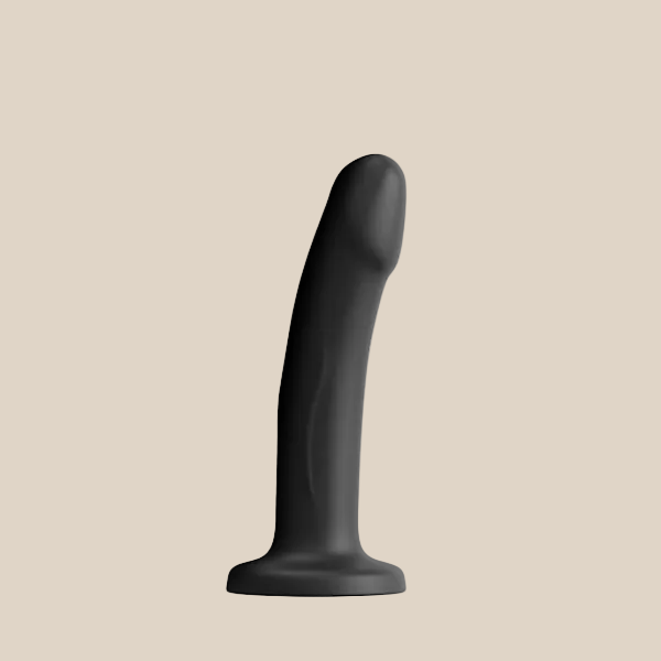 Black silicone curved dildo with a flared suction base on a plain background