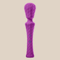 Purple silicone personal massager with textured hexagonal pattern, set against white background.