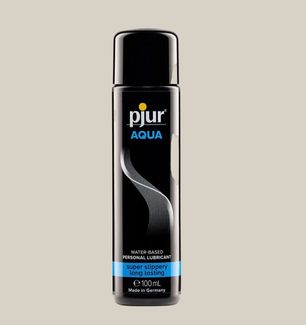 pjur Aqua water-based personal lubricant 100ml bottle with black label on beige background
