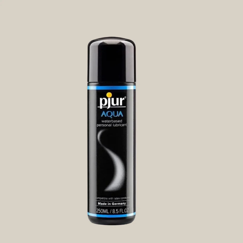 Pjur Aqua water-based personal lubricant 250ml bottle on a beige background