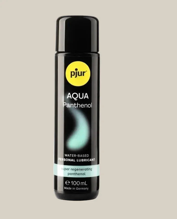 Pjur Aqua Panthenol water-based personal lubricant bottle, 100mL, beige background.