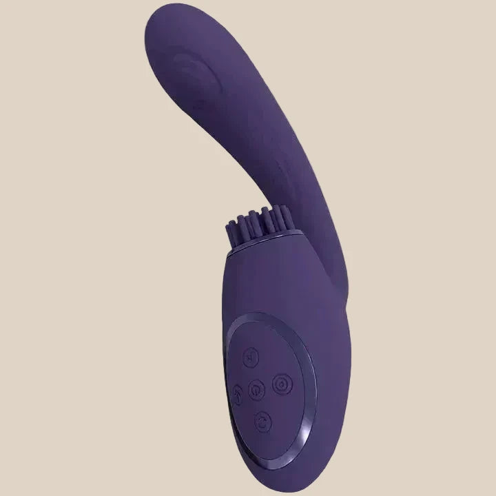 Purple silicone vibrator with curved tip, control buttons, and stimulation bristles on neutral background