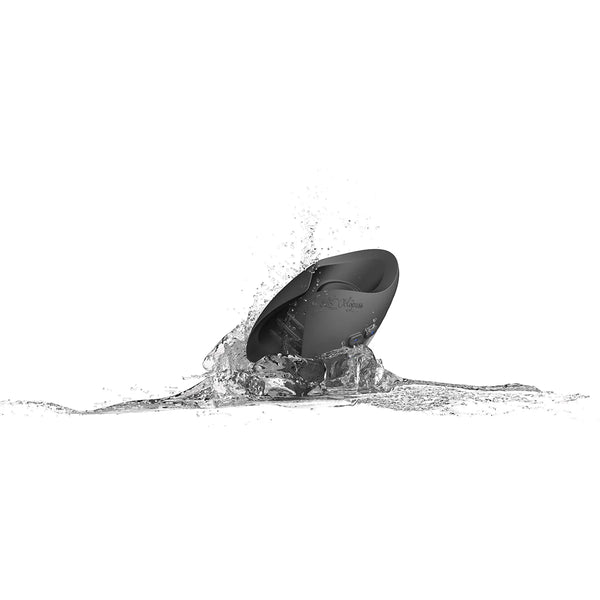 Black waterproof adult toy splashing in water on white background