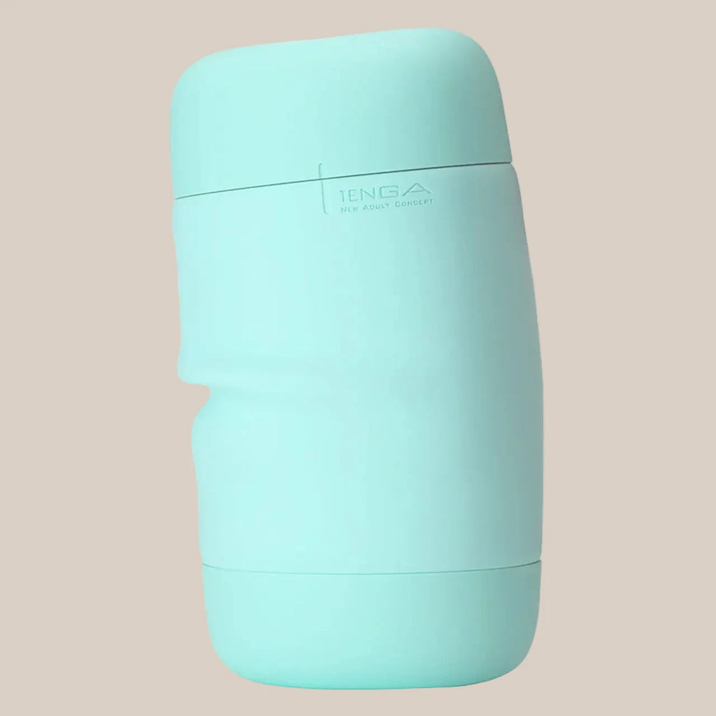 Mint green textured adult toy in discreet casing on neutral background