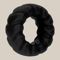 Black textured silicone ring for intimacy, body-safe adult toy on neutral background