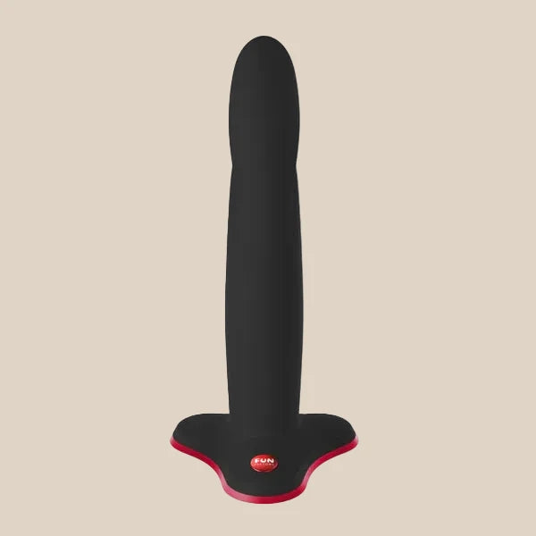 Black silicone adult toy with a flared red base, designed for safe and comfortable use.