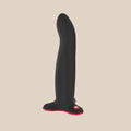 Body-safe black silicone vibrator with suction base and red accent, adult pleasure product