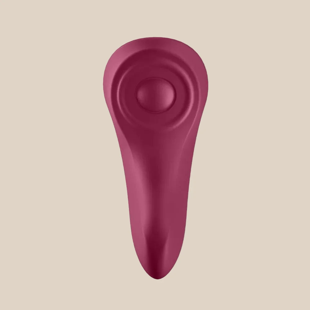 Burgundy silicone personal massager with curved design on white background