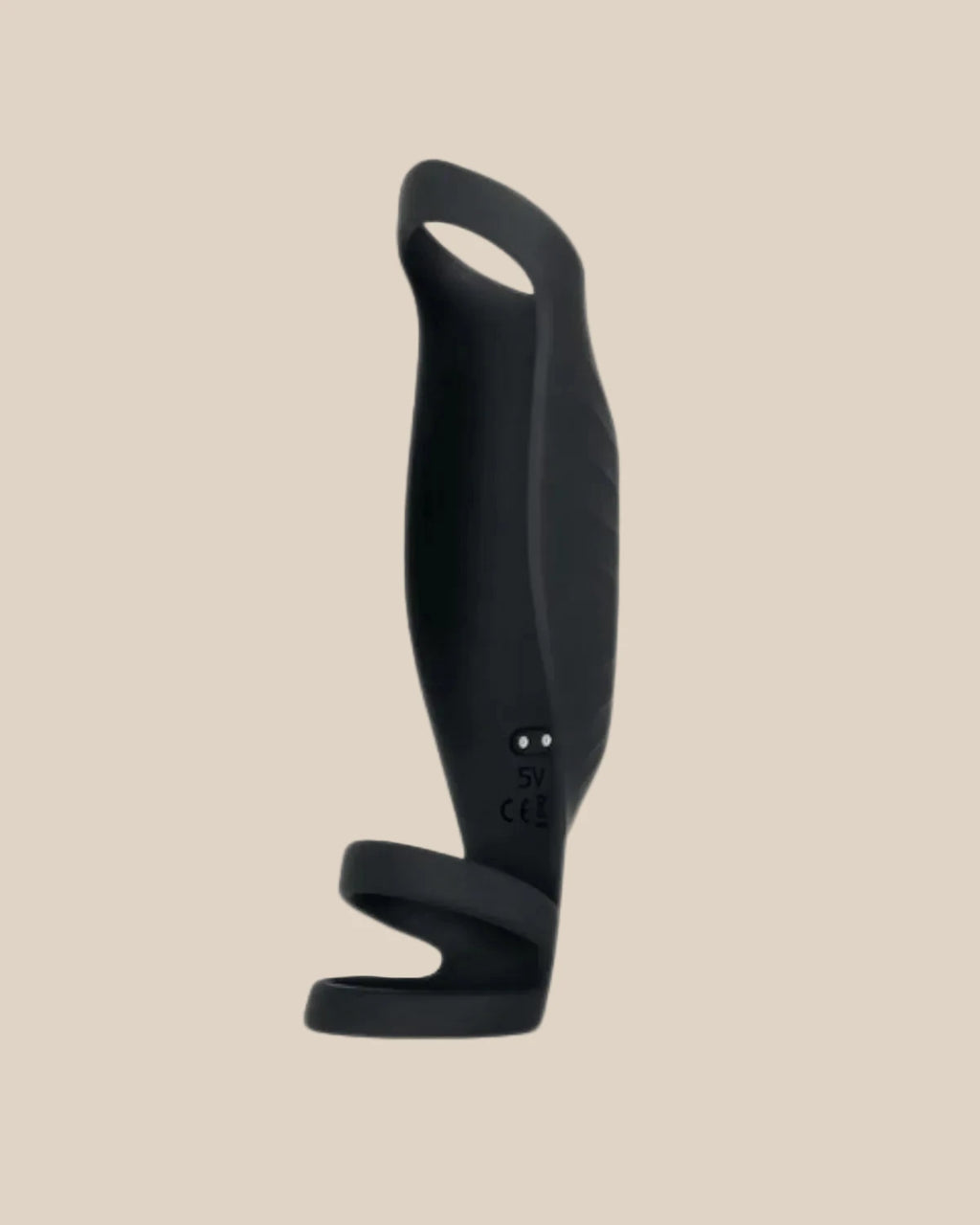Black silicone vibrating couples toy with ergonomic handle and curved design on beige background.
