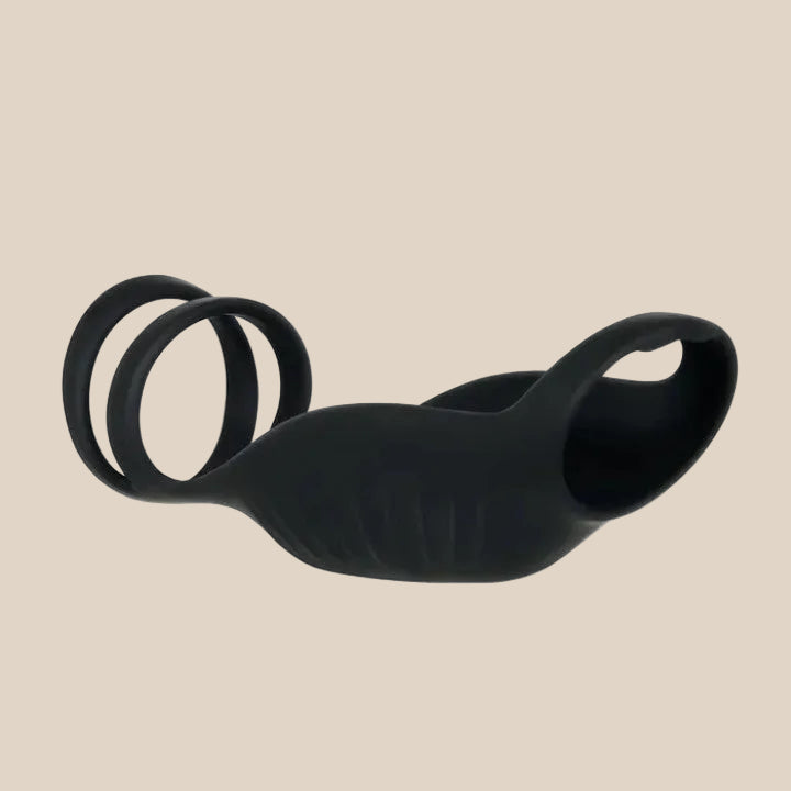 Black silicone adult intimacy ring with ergonomic design on a white background