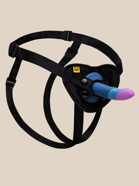 Adjustable black strap-on harness with a blue and purple silicone dildo on a plain background.