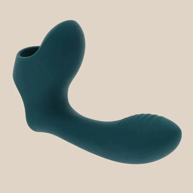Teal silicone adult toy with curved design and textured end, displayed on white background.