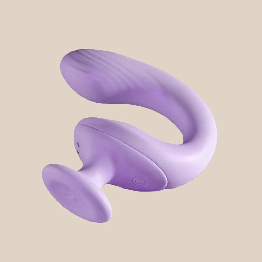 Purple silicone dual-ended body-safe personal massager on beige background
