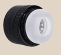 Black and white silicone stroker sleeve adult toy with textured interior, product isolated
