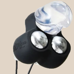 Compact black and silver personal massager with clear attachment on a neutral background