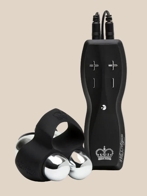 Black remote control with buttons and a silicone ring featuring metallic spheres, adult intimacy product