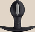 Black silicone anal plug with a flared base and silver accent, body-safe adult toy.