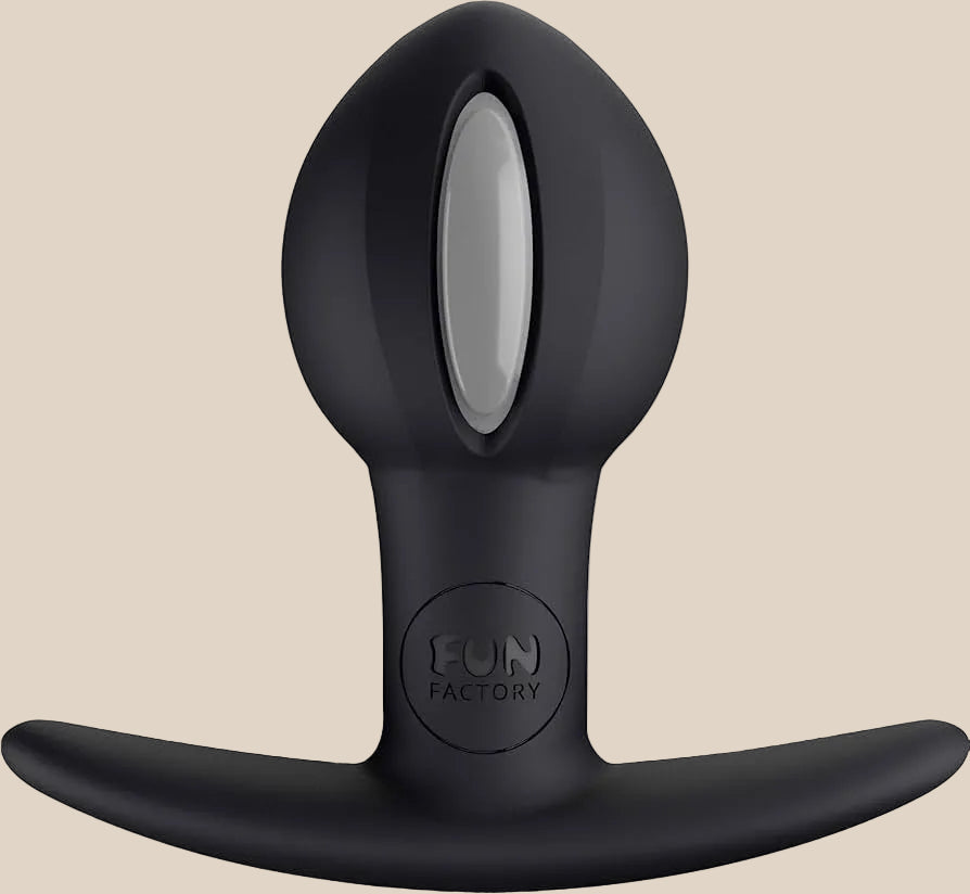 Black silicone anal plug with a flared base and silver accent, body-safe adult toy.