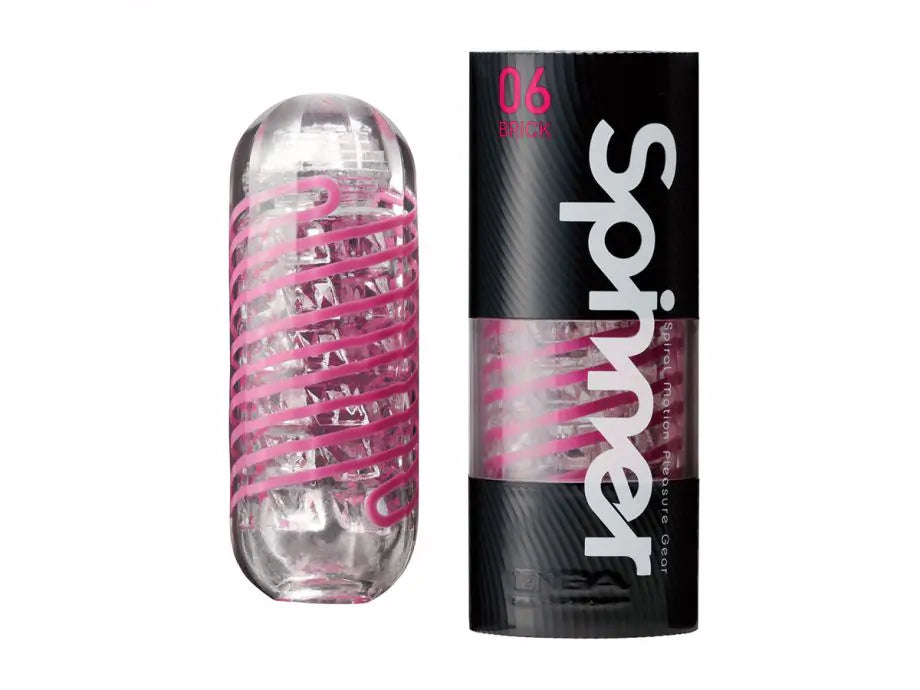 Transparent male pleasure sleeve with spiral texture beside black product packaging labeled Spinner 06 Brick.