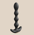 Black silicone beaded anal plug with curved base on neutral background