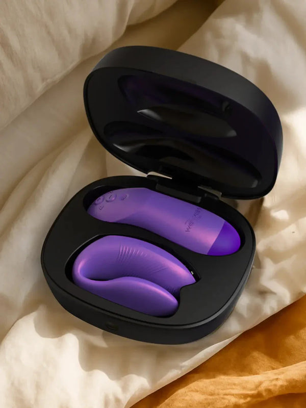 Cosmic Purple Chorus Pro docked in its magnetic USB charging case.