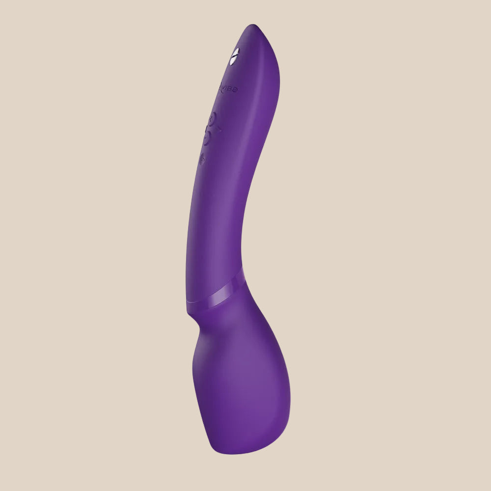 Purple silicone personal massager with ergonomic curved design and control buttons.