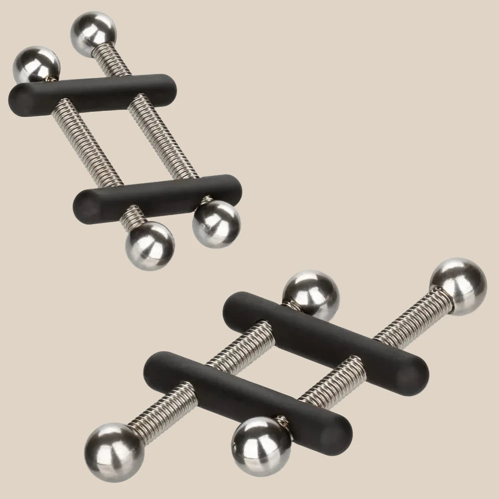 Close-up of the non-slip rubber coated crossbars and twin screw mechanism on CalExotics nipple clamps