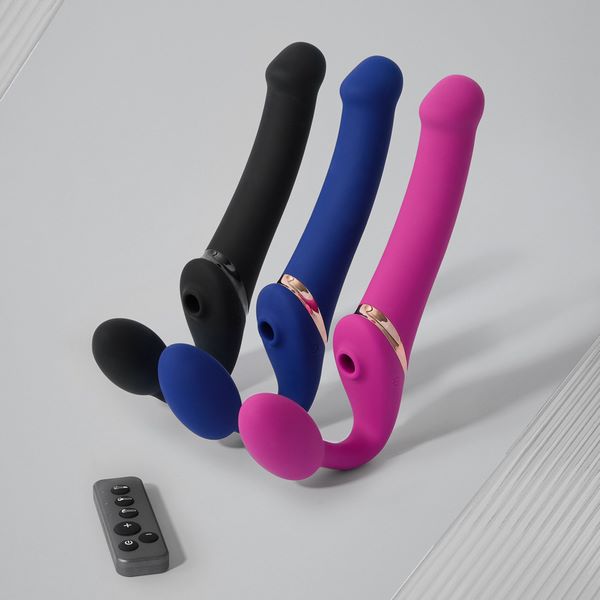 Three bendable strap-on toys in black, blue, and pink with a remote control