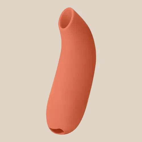 Dame Aer clitoral suction stimulator in Papaya orange at Noirette