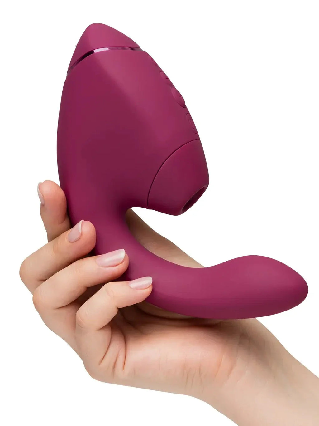 Person holding the Dusky Pink Womanizer Next Duo at Noirette, showcasing the sleek profile and medical-grade finish.